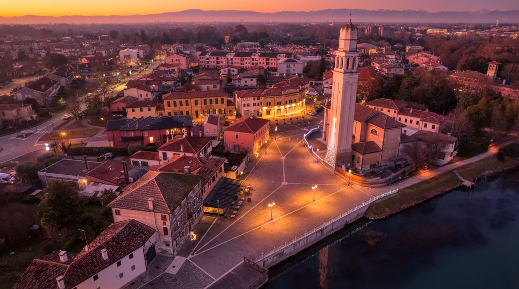 Aerial View of Casier harbour at Sunset during Christmas time with Bell Tower and Mountain Backdrop