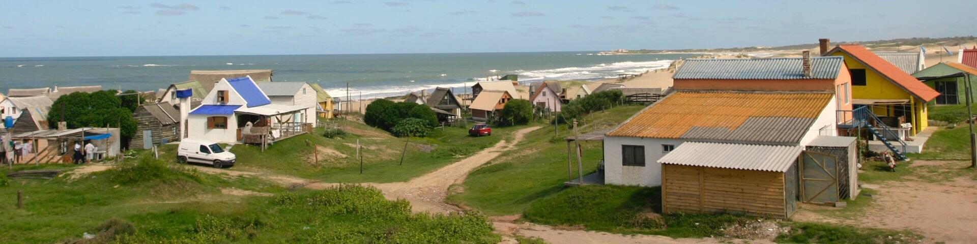 Punta del Diablo showing a coastal town and a house