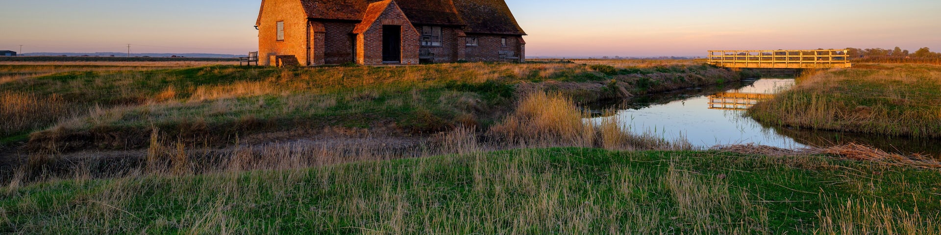 Autumnal clear evening sunset over St Thomas a Becket Church, Fairfield, in the Romney Marsh, Kent, UK