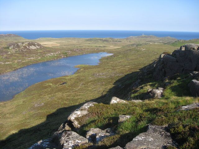 Loch Caorach From the lower slopes of Beinn nan Ord. Ardnamurchan Lighthouse can be seen.