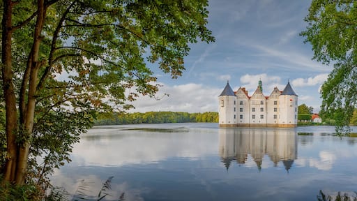 View of water castle Glücksburg on the Flensburg Fjord in the town of Glücksburg, Schleswig-Holstein, Germany. Renaissance castle on the lake in Glucksburg.