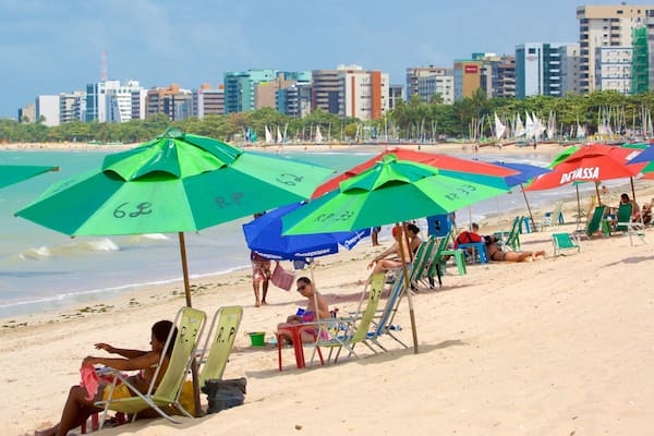 Pajucara Beach which includes a beach, skyline and a coastal town