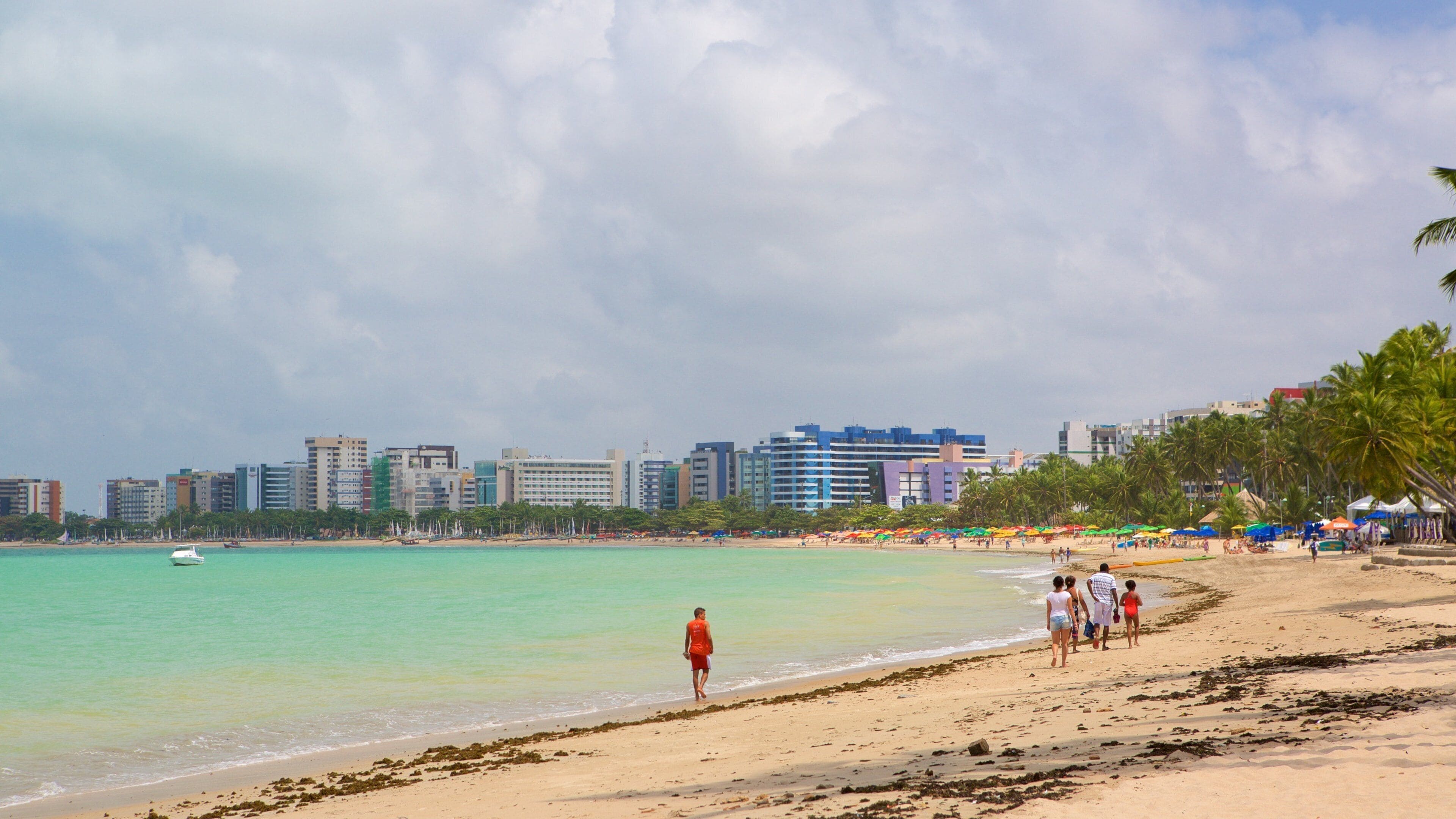 Pajucara Beach which includes a beach, skyline and general coastal views