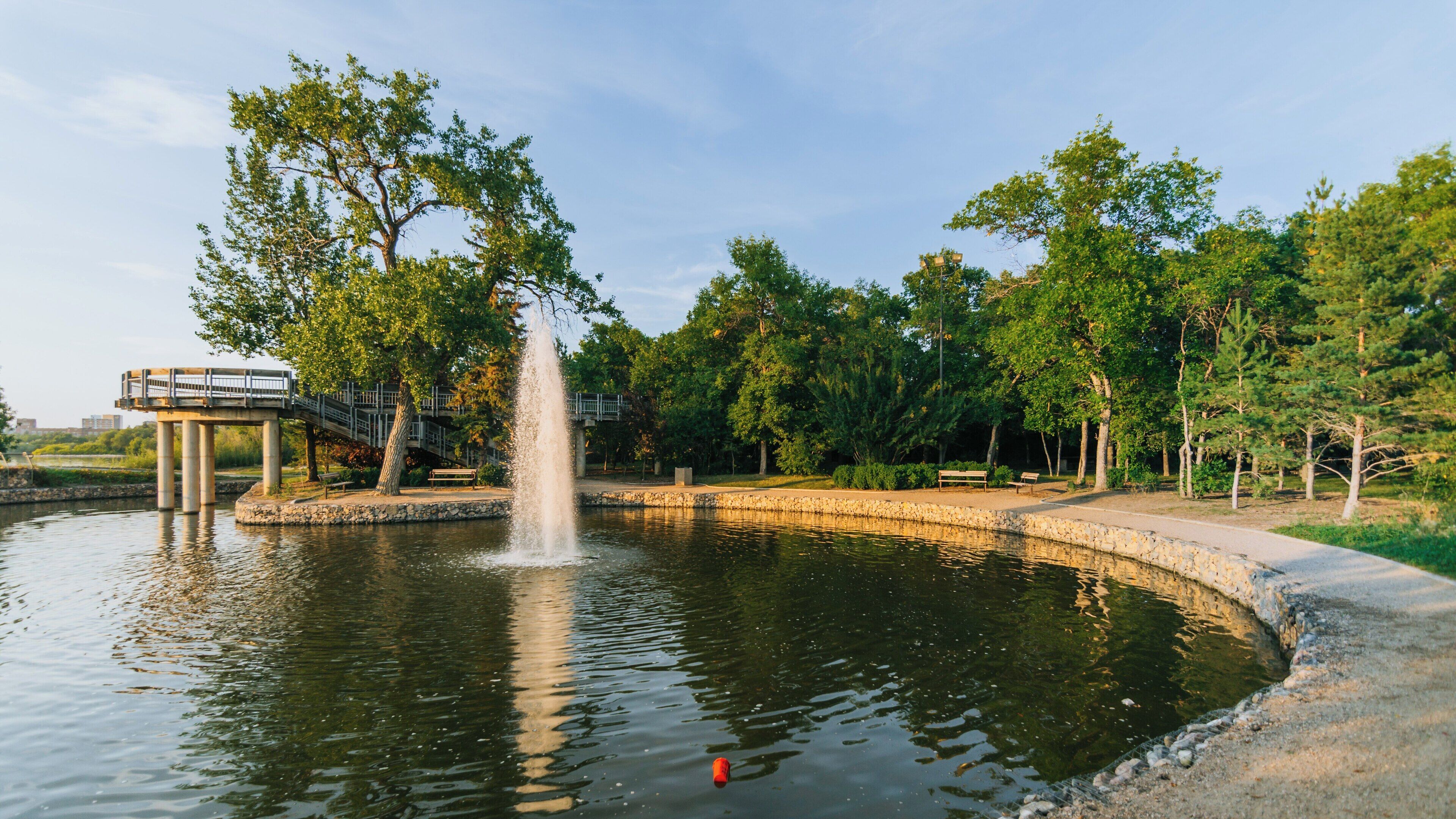 Stunning fountain creates a serene atmosphere in Wascana Park, Regina, Saskatchewan during a sunny day