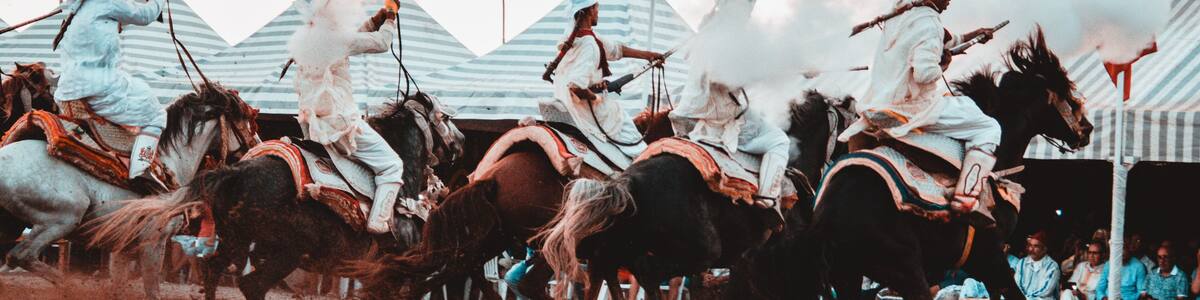 Tbourida Fantasia Morocco inezgane festival kssima knights on horses show with arms