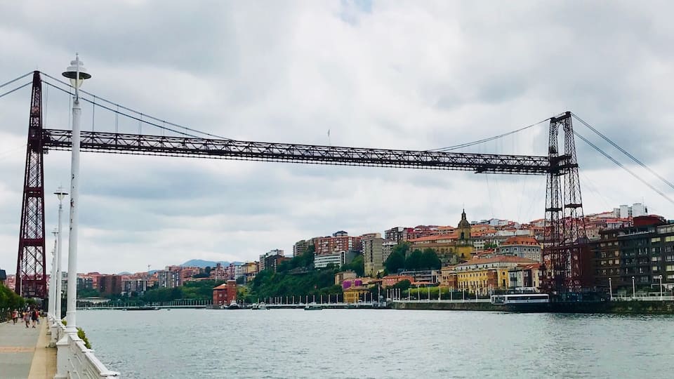 Getxo is a residential town close to Bilbao. Hardly anyone speaks English, but they are all very nice and there’s tons a small places serving pintxos and drinks. This ‘hanging bridge’ is the Bizkaia Bridge, a transportation device that bring cars and people across the river between Getxo and Portugalete.