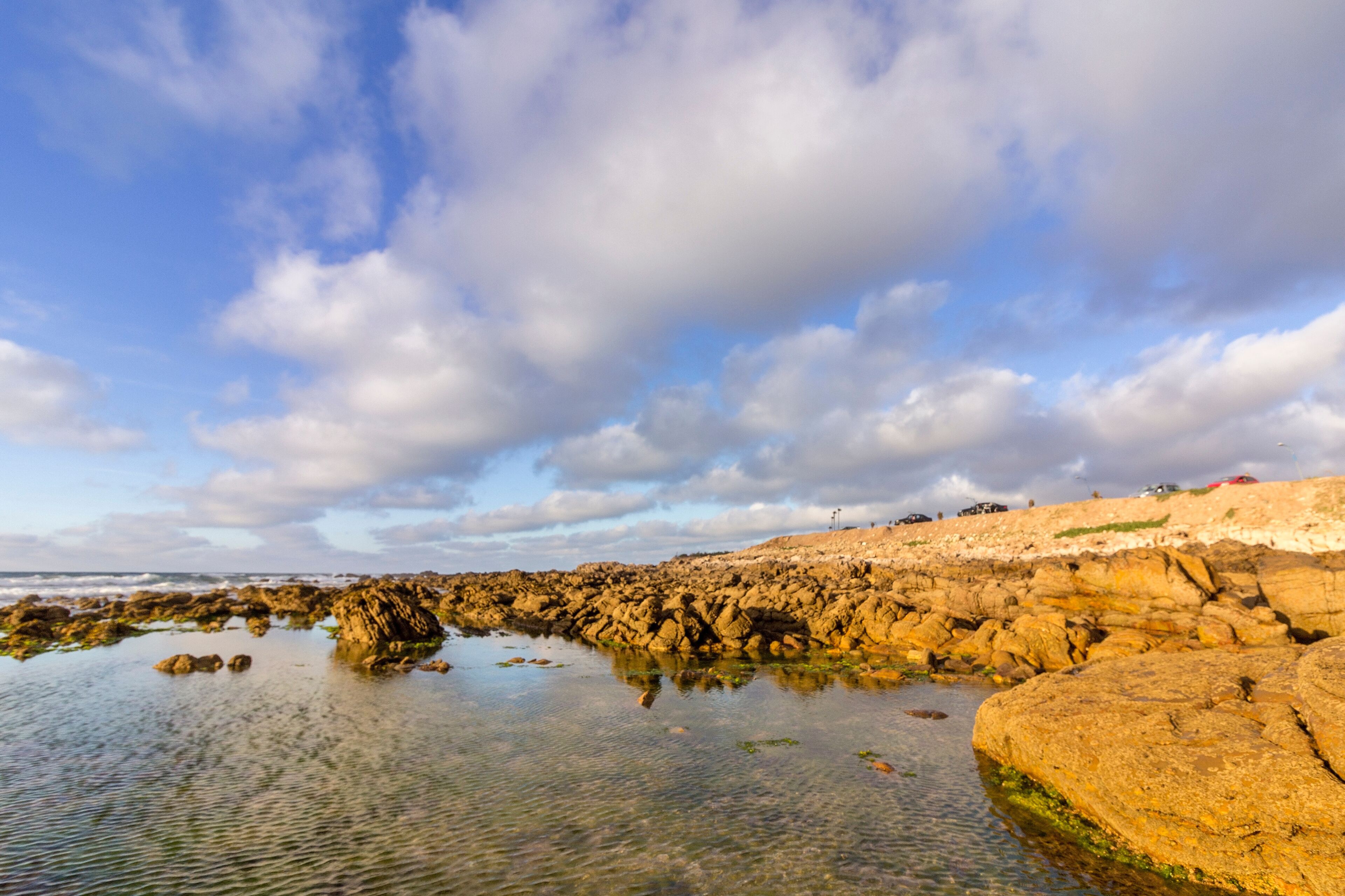 Cloundscape Atlantic Ocean view at Dar Bouazza rocky beach, in Casablanca south coast.
