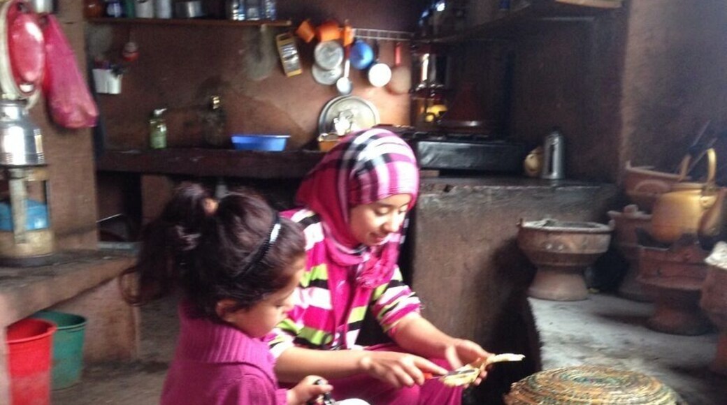 Berber mother and daughter cooking in their kitchen.