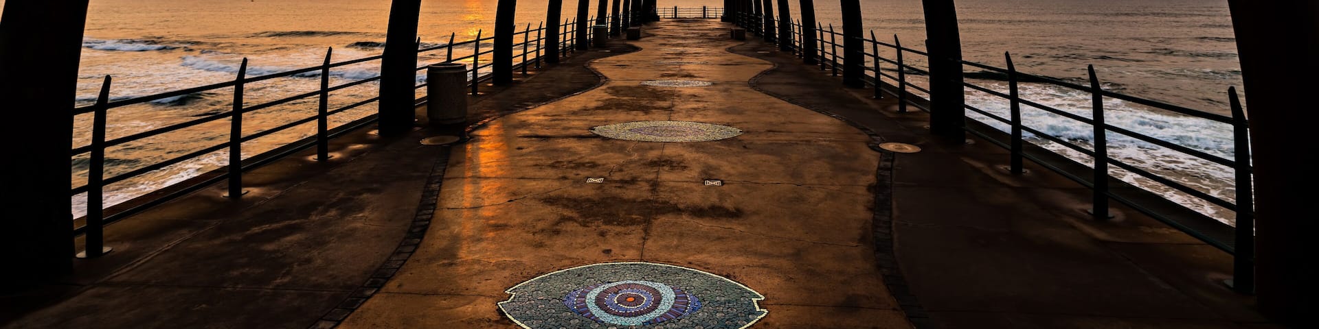 View of the Indian Ocean through the Millenium Pier in Umhlanga Rocks at Sunrise
