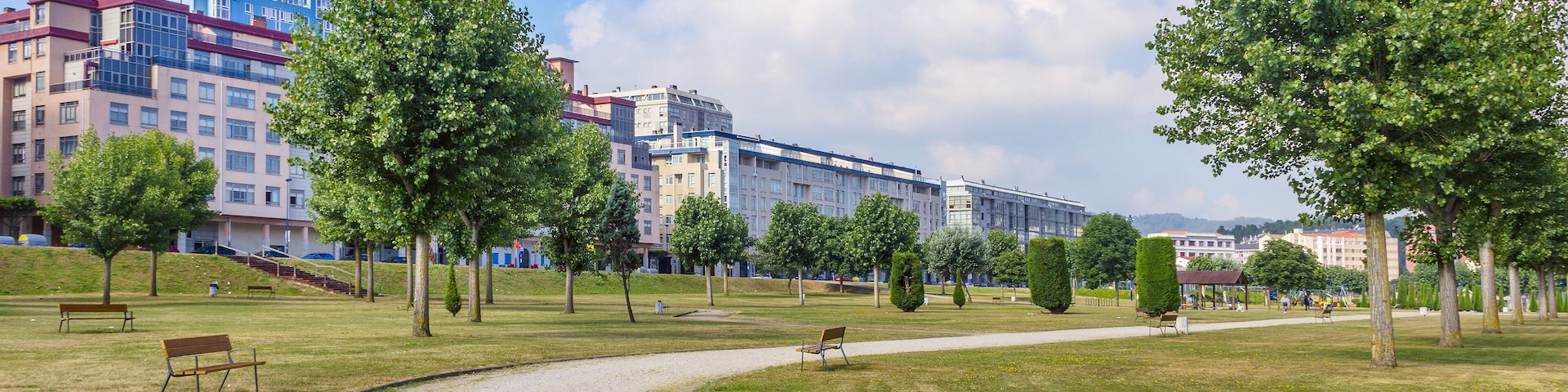 Trail, trees and meadows in the boardwalk park of O Burgo, Culleredo town