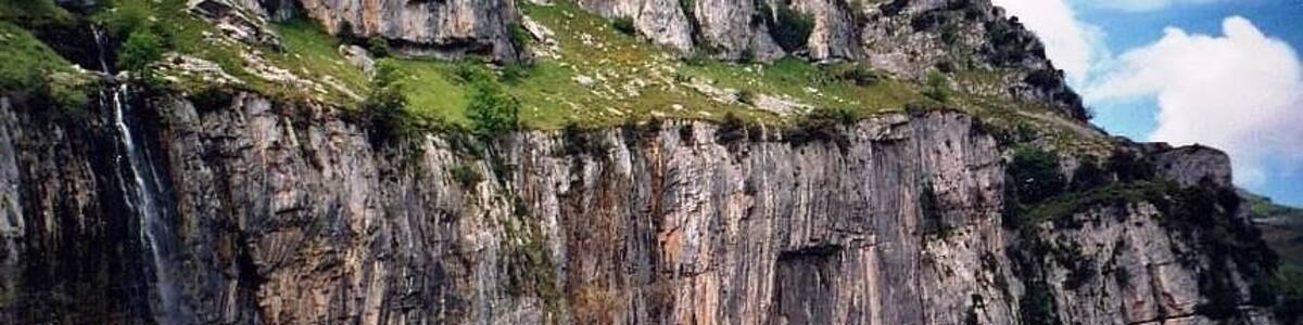 Source of the river Ason in the Natural Park Hillocks of the Ason (Cantabria, Spain). Resurgent stream in a karst region. The water falls by a cascade of more than 50 meters of height.