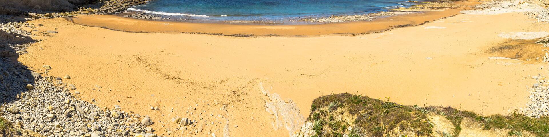 Panoramic view of Portio beach on sunny day, Pielagos, Cantabria, Spain