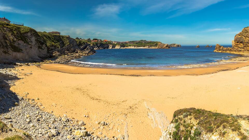 Panoramic view of Portio beach on sunny day, Pielagos, Cantabria, Spain