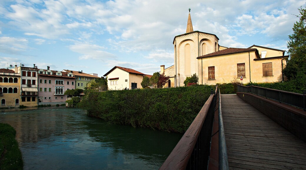 The bell tower and the cathedral of San Niccolò in Sacile on the river livenza.
Pordenone district, Italy.
