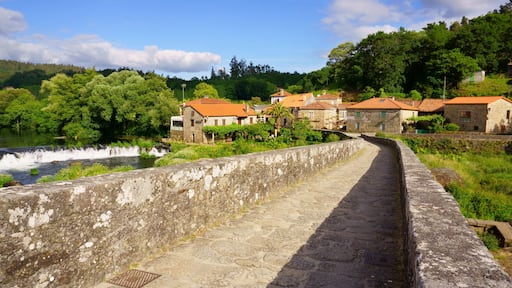 The Camino of Santiago on its passage through the roman bridge Ponte Vella in Ponte Maceira, Ames, Galicia, Spain