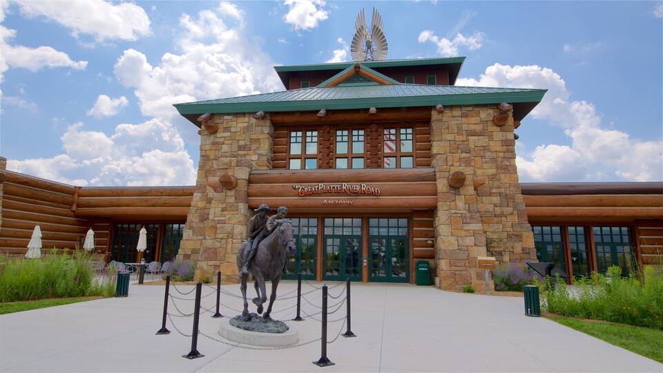 A log cabin-style building with a sign reading "The Great Platte River Road Archway".
