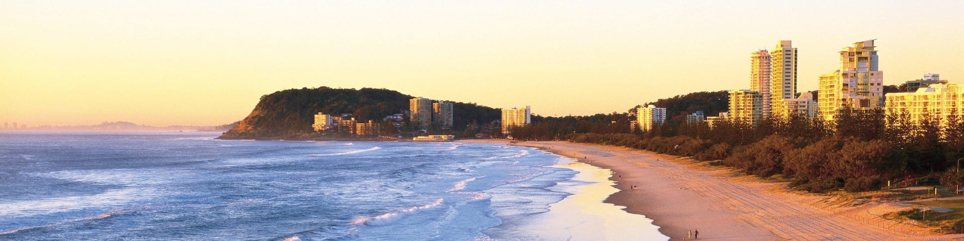 Burleigh Beach featuring a sandy beach, tropical scenes and a sunset