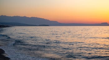 Sunset in the beach of Aegeian sea in Adelianos Kampos resort, Crete island, Greece