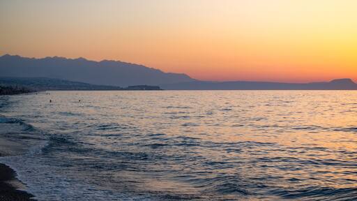 Sunset in the beach of Aegeian sea in Adelianos Kampos resort, Crete island, Greece