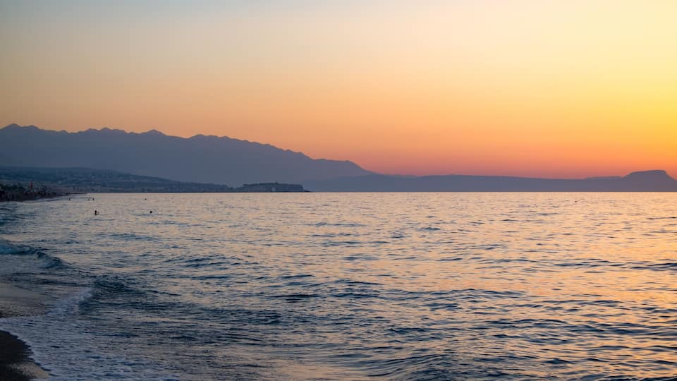 Sunset in the beach of Aegeian sea in Adelianos Kampos resort, Crete island, Greece