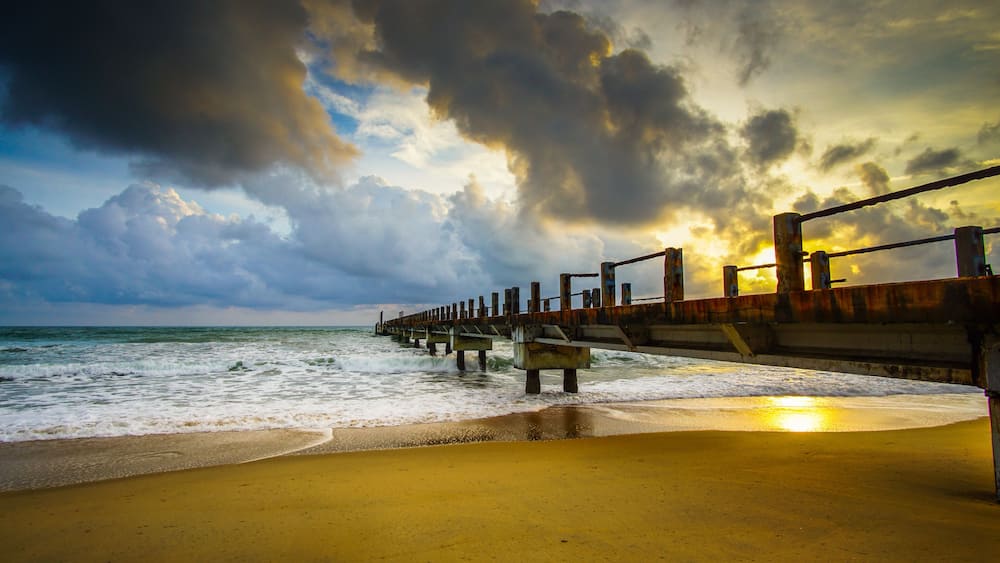 Boardwalk on beach at sunrise . Awana Kijal, Kemaman. Malaysia.