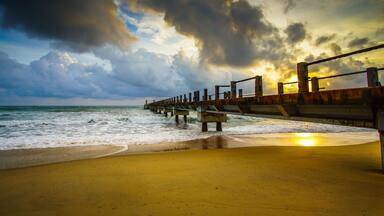 Boardwalk on beach at sunrise . Awana Kijal, Kemaman. Malaysia.