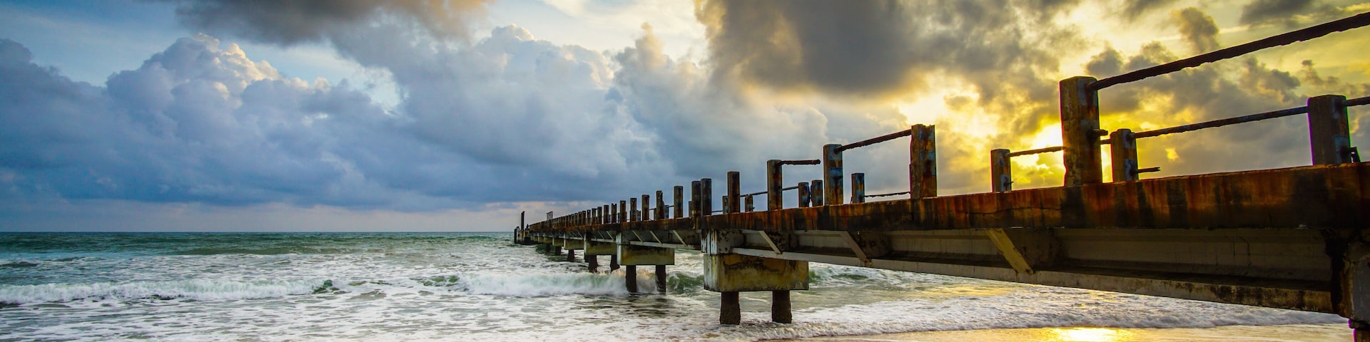 Boardwalk on beach at sunrise . Awana Kijal, Kemaman. Malaysia.