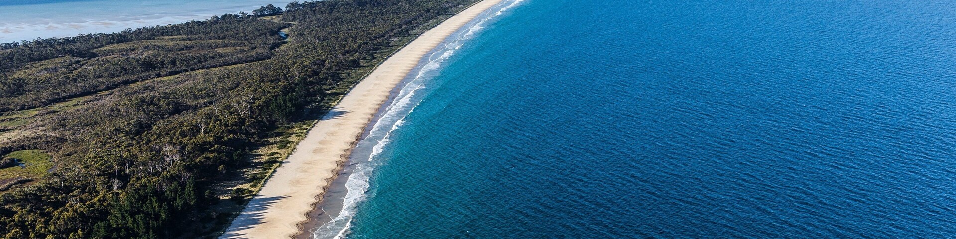 Bruny Island showing a sandy beach and general coastal views