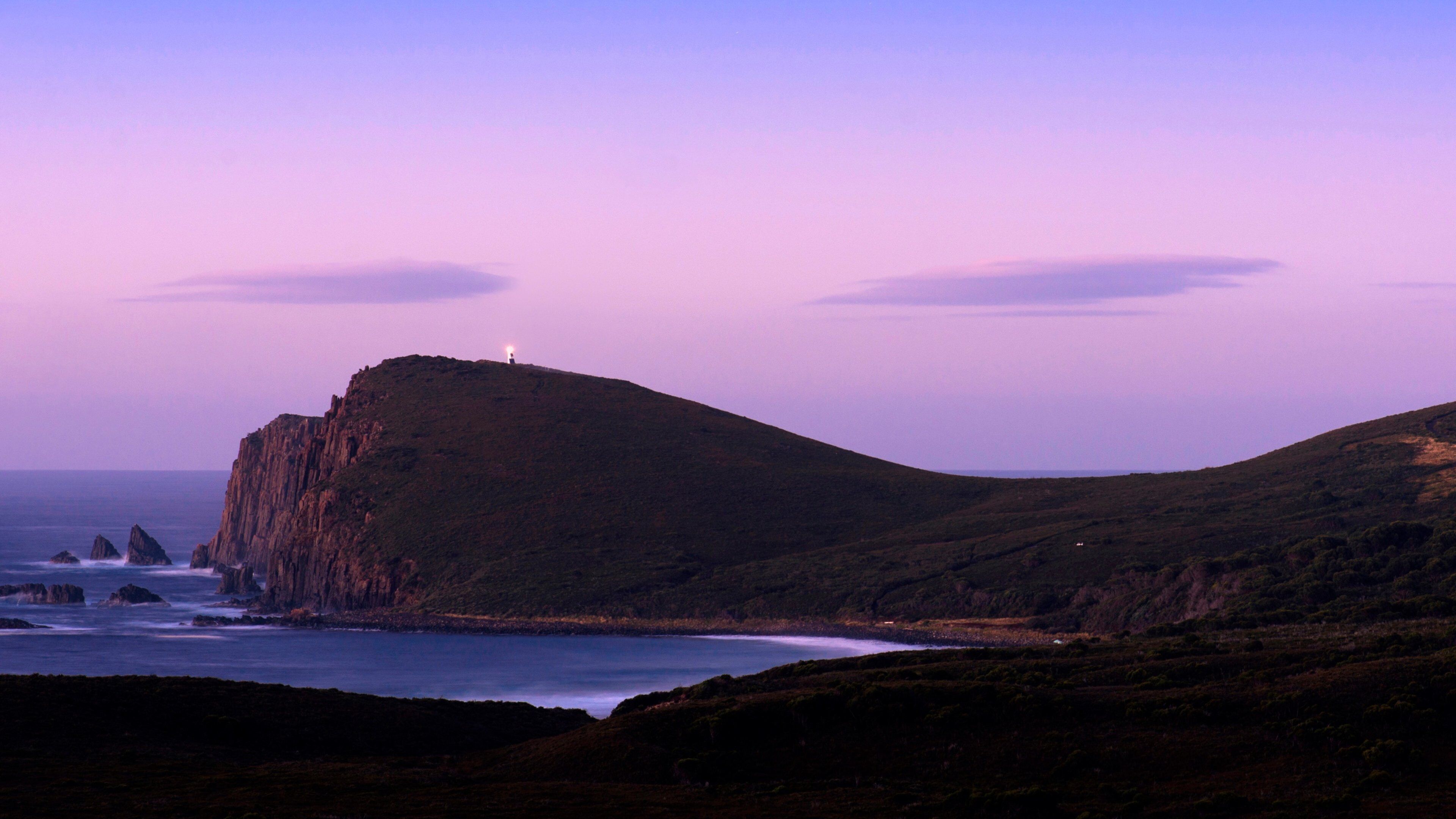 Bruny Island som inkluderer solnedgang og klippelandskap