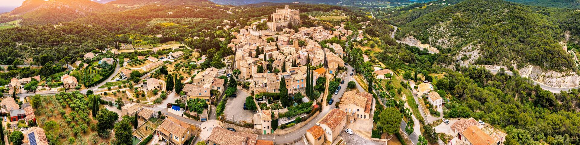 The beautiful medieval town of Le Barroux, Vaucluse, Provence, France. Aerial view of Le Barroux village with its castle, Provence, France. Perched village of Barroux and its fortified castle, France.