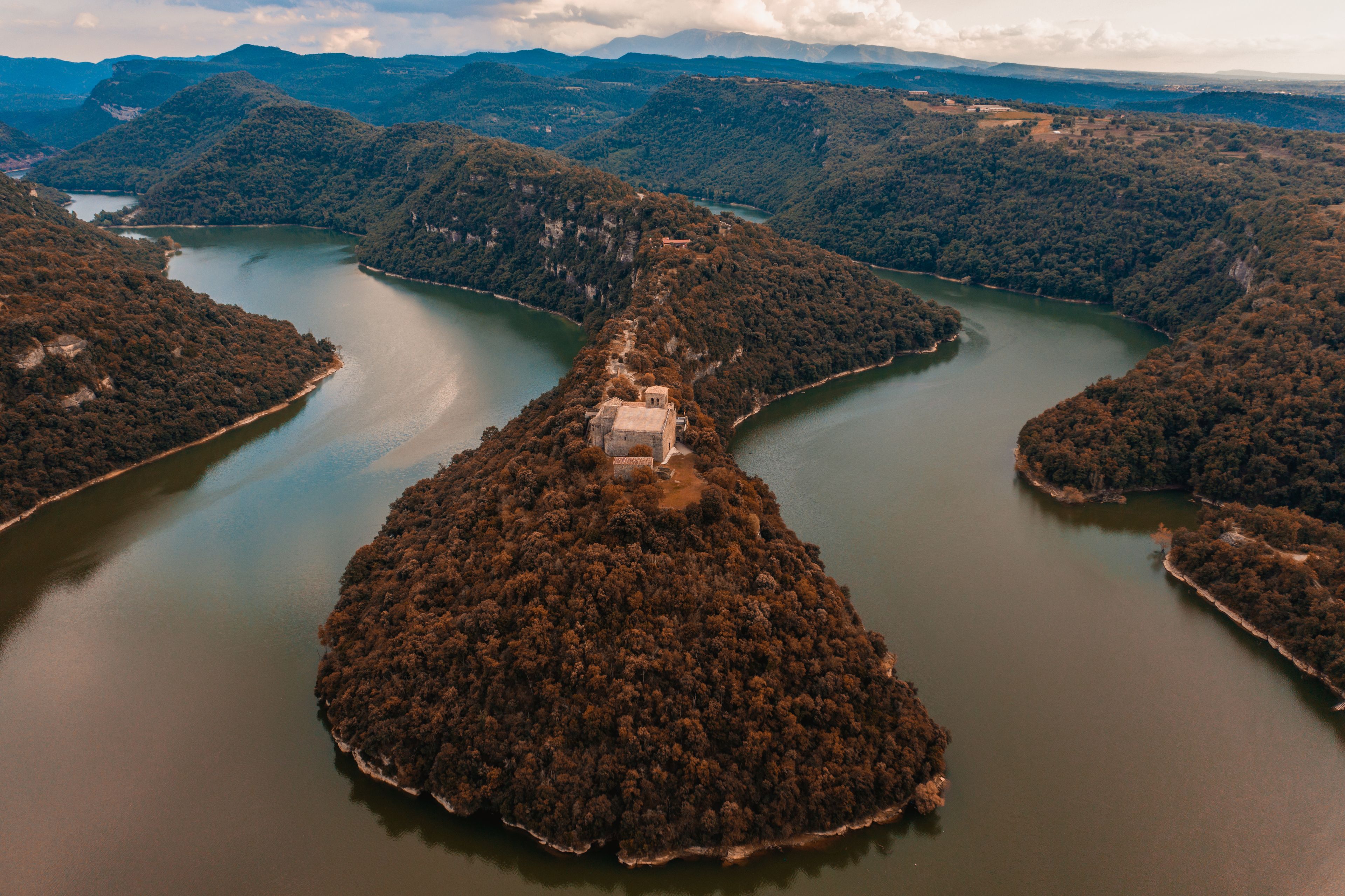 Aerial view of the Sant Pere de Casseres monastery along the Riu Ter river in Pyrenees. Vic, Spain.