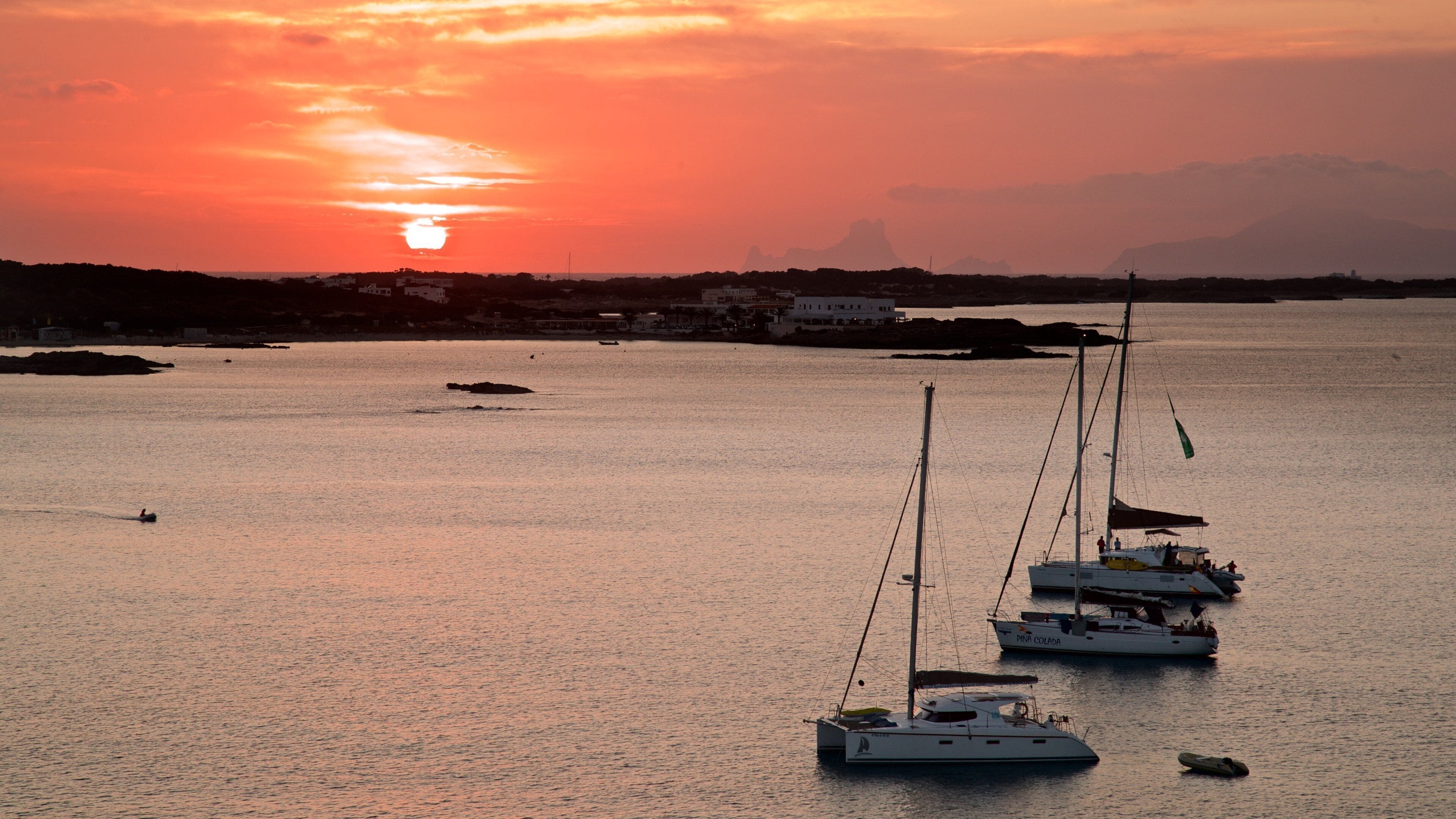 Formentera featuring a sunset, a bay or harbor and general coastal views