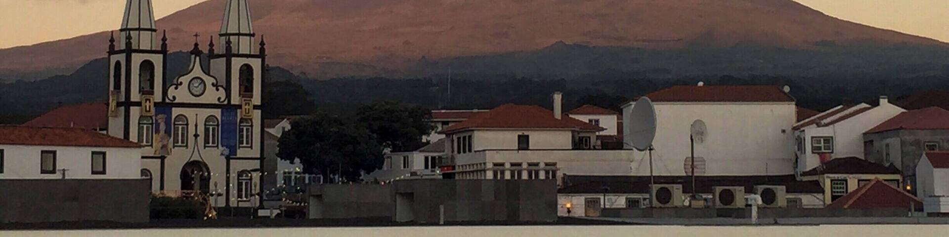 If you are traveling to the Açores (Azores), I highly recommend a stop on Pico Island. The unique landscape of volcanic rock, historical vineyards, and Mount Pico jutting out of the center of the island are breathtaking. You can stay on the island, or if you prefer, you can stay in Horta on Faial Island and take the ferry across for the day. Here, we captured the pinks of the sunset reflecting on Mount Pico as we pulled out of the ferry station in Madalena, headed back to Horta. #InStone #VolcanicRock #MountPico #Azores