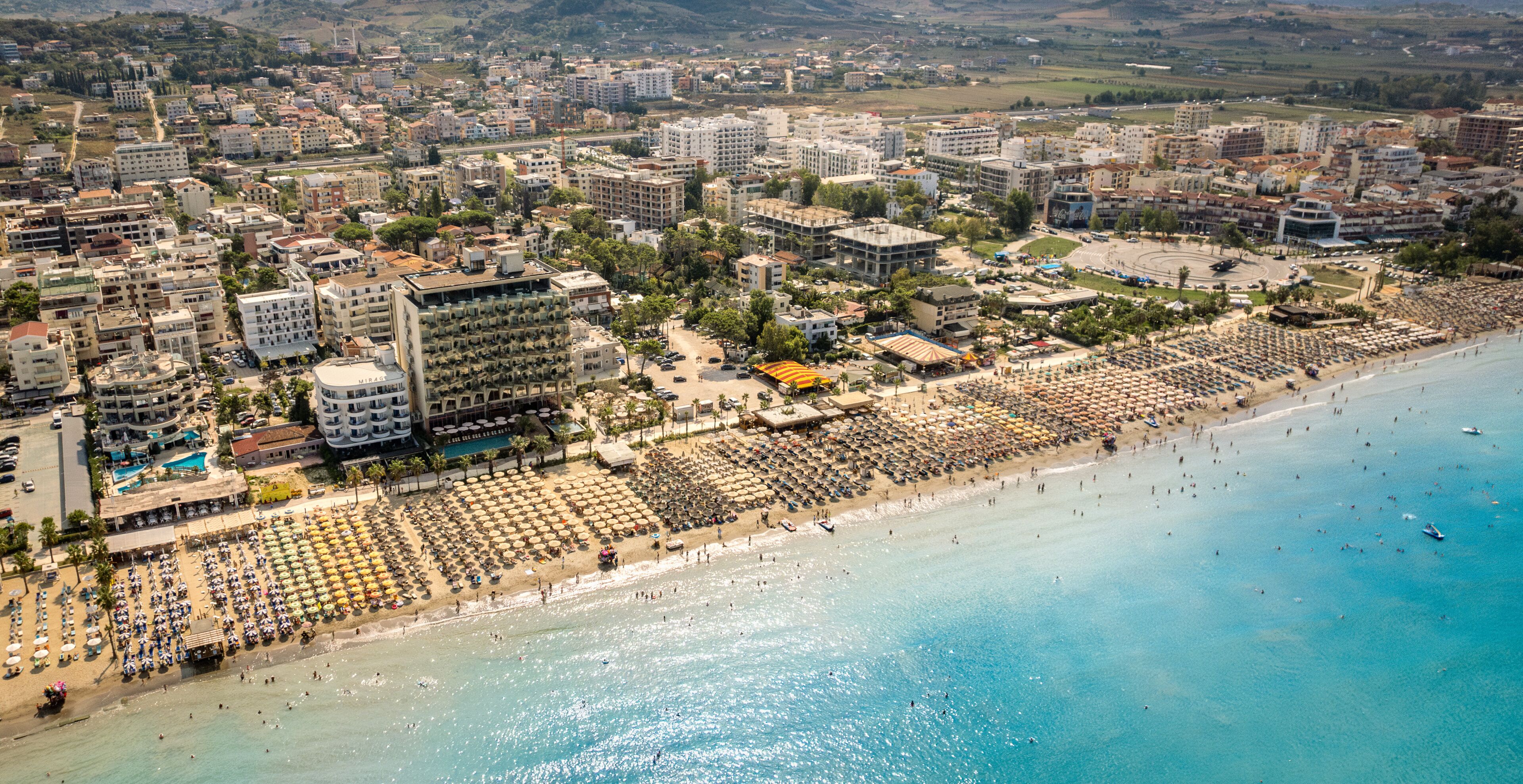  Golem, Durres, Albania - 22 august 2023: Aerial view to sandy beach full of umbrellas and people in summer season 2023