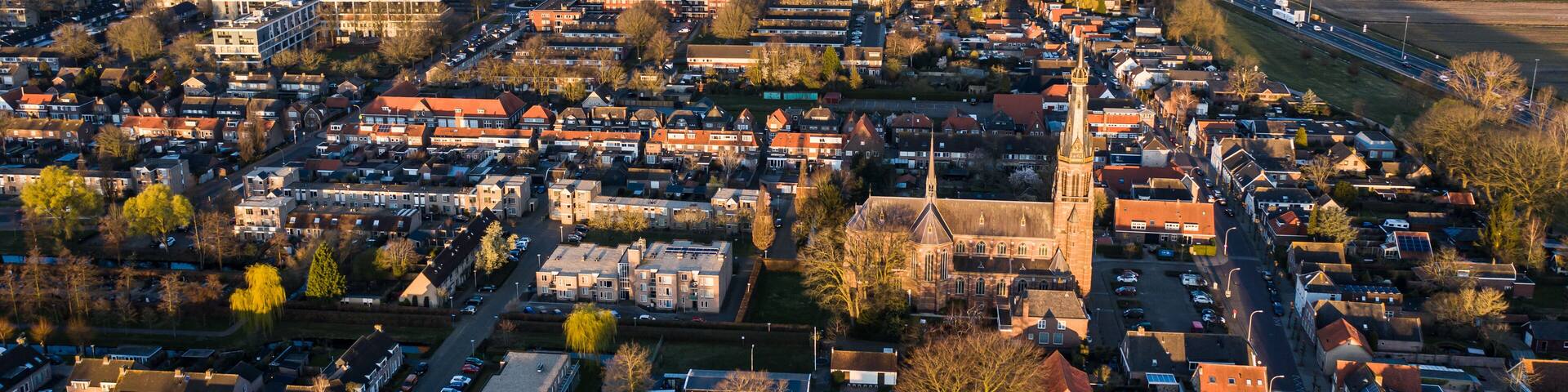 A church during sunrise on a sunny morning in the dutch town of Waalwijk, Noord Brabant, Netherlands