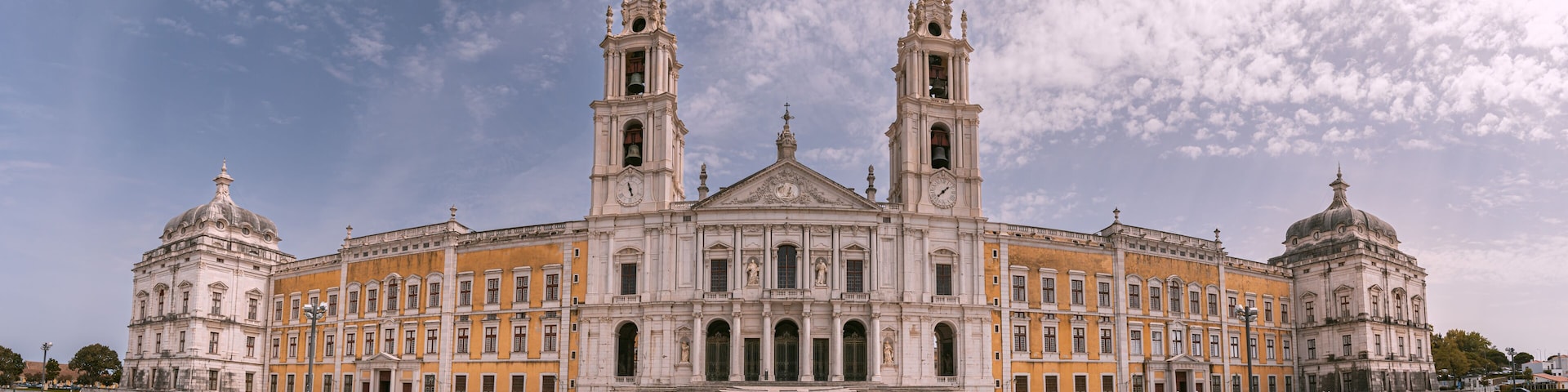 A large historic building with two towers and a central dome.