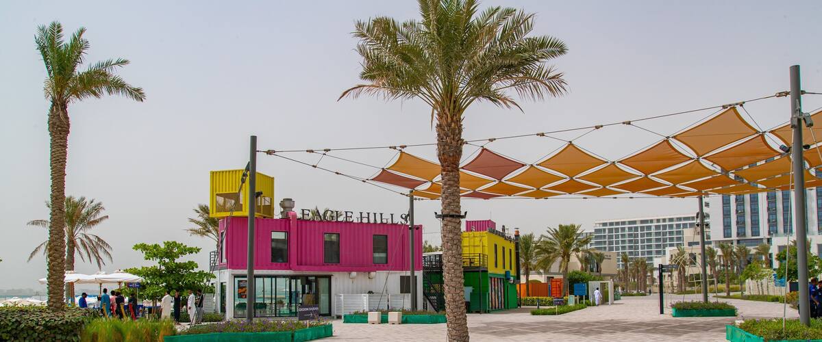 Muharraq showing a sandy beach and a coastal town