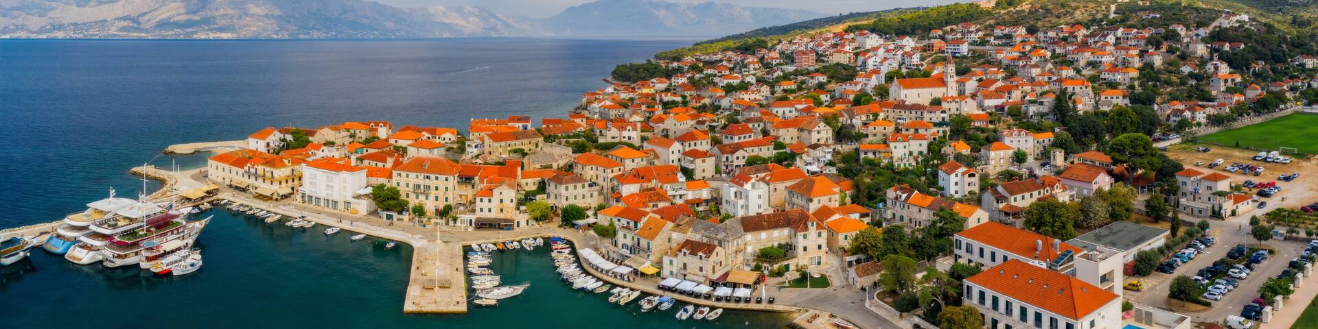 Aerial panoramic drone view on village Postira on Brac island, Croatia. August 2020