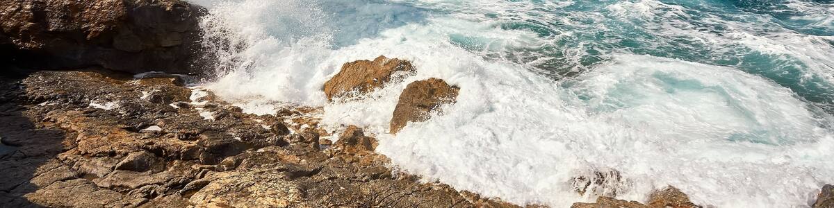 Waves beat on the rocky shore, Mediterranean Sea.