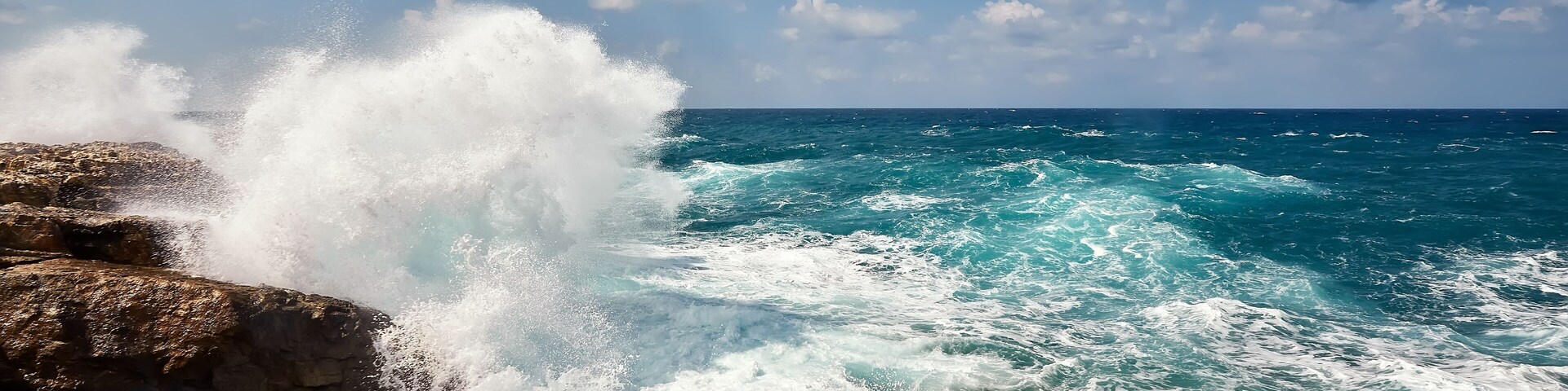 Waves beat on the rocky shore, Mediterranean Sea.