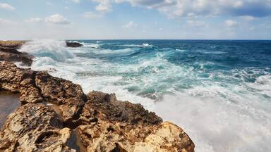 Waves beat on the rocky shore, Mediterranean Sea.