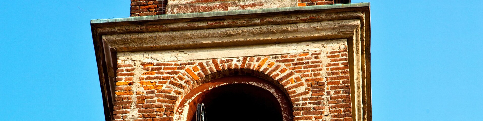 in mozzate old abstract tower bell sunny day milan