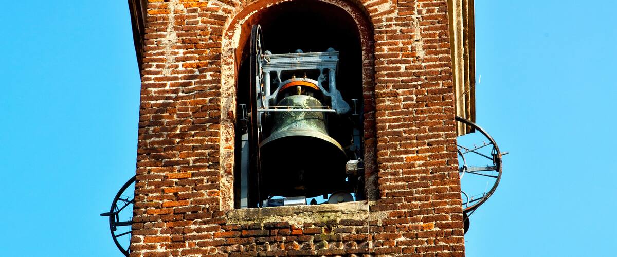 A clock tower with a bell.