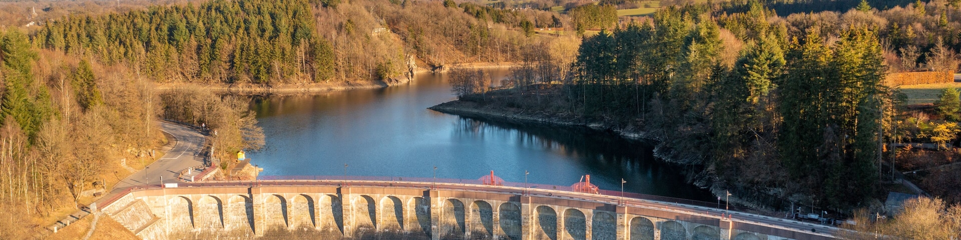 Aerial view of Barrage de Robertville, a dam stopping the water of Robertville lake in Waimes, Liège, Belgium.