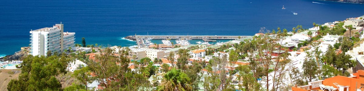 Los Gigantes featuring general coastal views, rugged coastline and a coastal town