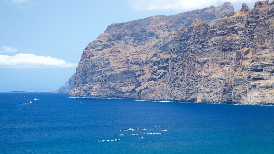 Los Gigantes which includes rocky coastline and boating