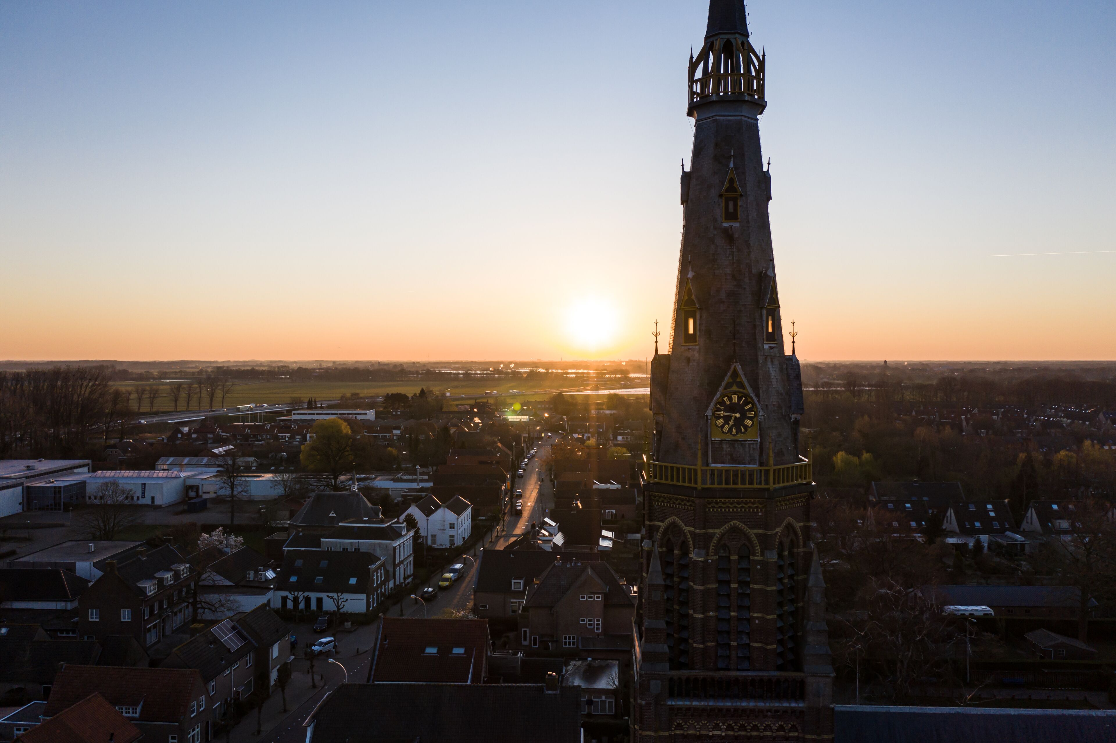 A church during sunrise on a sunny morning in the dutch town of Waalwijk, Noord Brabant, Netherlands
