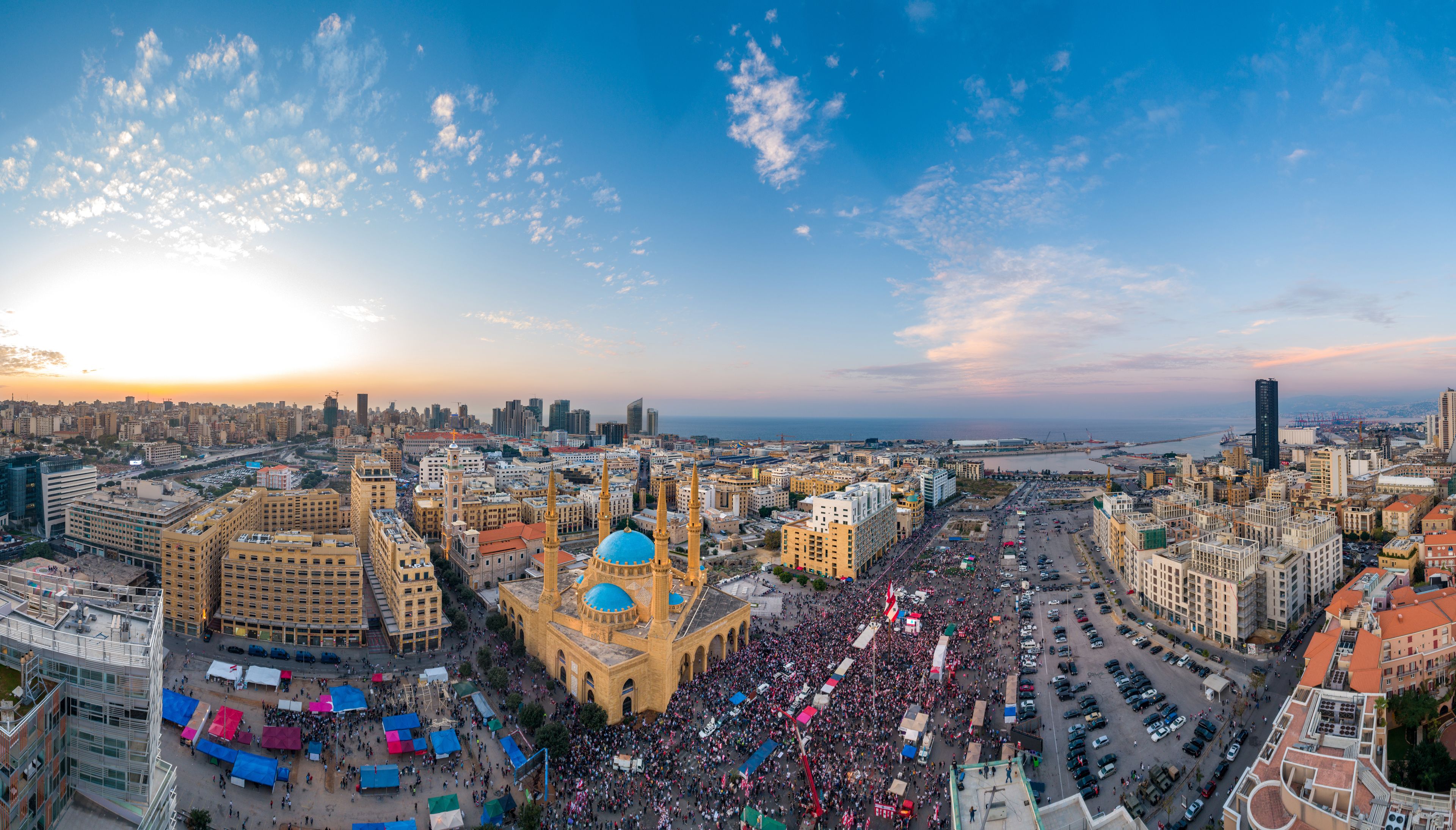 Beirut, Lebanon, 22 November 2019 : sunset drone panorama shot in Martyr square, on Lebanon independence day, during the Lebanese revolution, with thousands of people revolting against government
