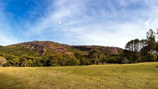 180º panoramic view of the natural monument of Pedra Grande in Atibaia, São Paulo - Brazil. Local vegetation, mountain and blue sky with clouds.