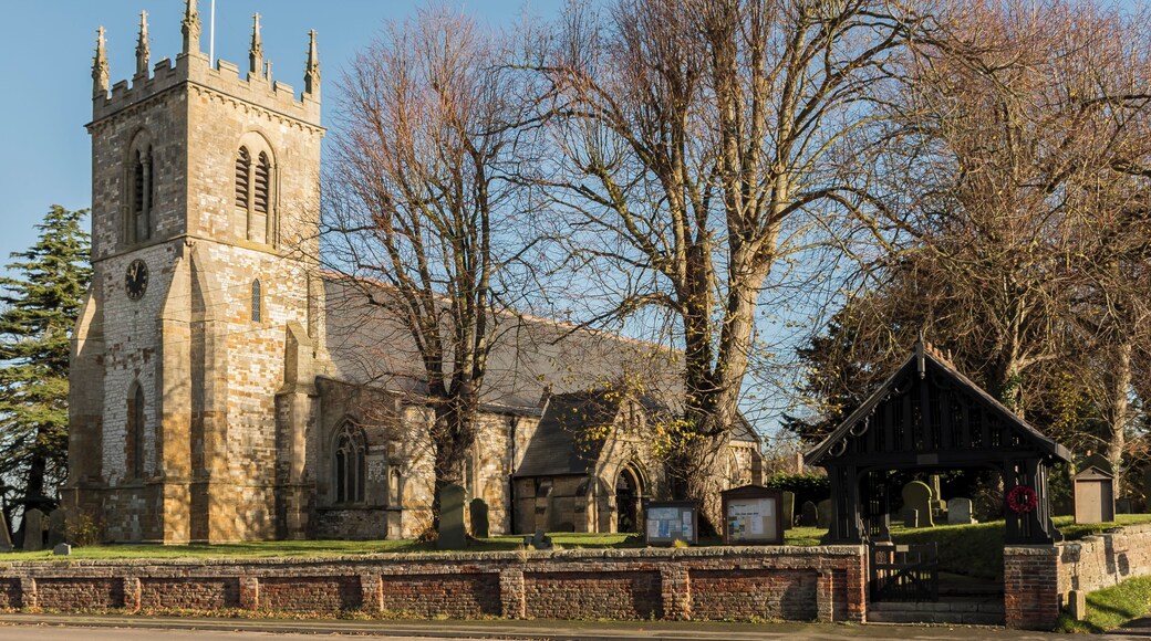 The church dates from the 12th C. onwards and has a western tower, 4 bay aisled nave, 3 bay chancel and south porch. The tower dates from the 13th C. and has 15th C. crocketted pinnacles. The chancel is probably the oldest part, dating from the early 13th C. The church has a 12th C. Tournai Marble font similar to Lincoln Cathedral. The church was restored by J. Fowler in 1884